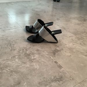 Black and silver slides. Size 36. Only worn once.